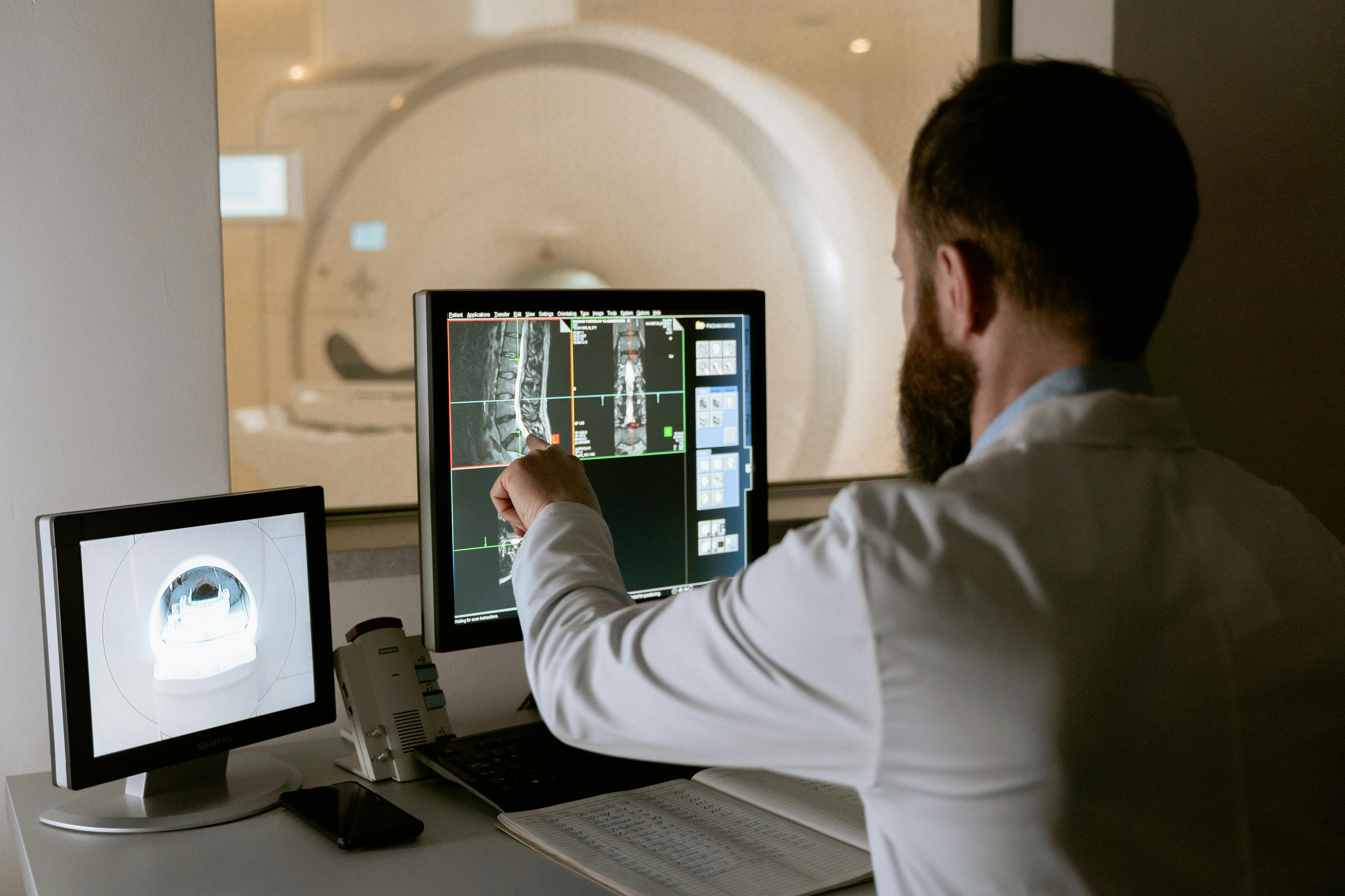 Medical professional reviewing diagnostic scans - Photo by MART PRODUCTION on Pexels